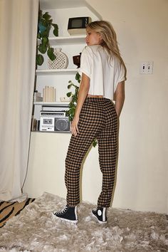 You are the trend setter in the Bishop Tan Checkered Cropped Trousers. Made with everyone's favorite checkered print and a straight leg fit, these are the pants you have been searching for! Style with a cropped tee or a chunky sweater, you will be able to rock these trousers in every way imaginable. STYLE RECOMMENDATIONS: - pair with some high tops and a cropped tee for a casual look, or spice it up with some wrap sandals and statement earrings SIZE RECOMMENDATIONS & MATERIALS: - light weight t Plaid Long Pants For Fall, Fall Plaid Long Pants, Fall Plaid Long Bottoms, Trendy Plaid Trousers, Casual Gingham Ankle-length Pants, Casual Plaid Tapered Leg Pants, Relaxed Fit Plaid Pants For Fall, Plaid Relaxed Fit Pants, Plaid Relaxed Fit Trousers