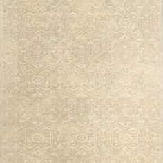 a beige rug with an intricate design on it