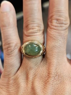 You are viewing a beautiful 14k solid gold jade ring. The ring size is 6  The ring is marked ming's and 14k. The band is 3mm wide. Beautiful gold leaf intricate design . Good pre owned condition Luxury Engraved Jade Jewelry, Antique Emerald Ring In 14k Gold, Antique 14k Gold Emerald Ring, Formal Oval Jade Emerald Ring, Elegant Engraved Emerald Ring For Formal Occasions, Green Carved Rings For Formal Occasions, Elegant Green Signet Ring Stamped 14k, Elegant Oval Engraved Emerald Ring, Elegant Oval Emerald Ring Engraved