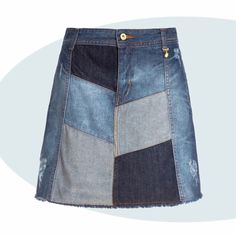 a denim skirt with patches and buttons on the side