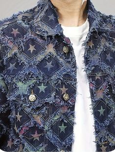 a man wearing a blue jacket with stars on it