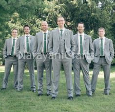 a group of men in suits standing next to each other