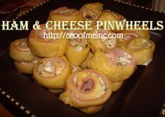 ham and cheese spirals on a black plate with the words ham & cheese spirals