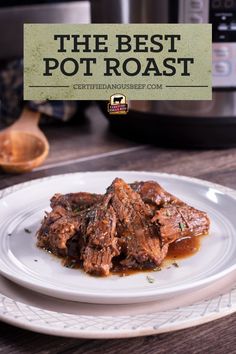 a white plate topped with meat covered in gravy next to an instant pot roast