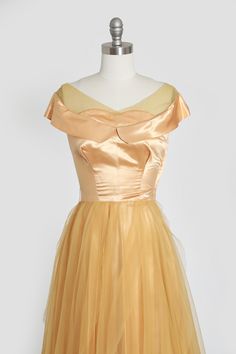 "Stunning 1950s gold satin evening dress Off the shoulder sheer chiffon with flowing layered chiffon skirt Side metal zipper Great vintage condition made extremely well! M e a s u r e m e n t s: -------------------------------------- Size: XS BUST: 17\" Waist: 12 3/4\" Hips: 32\" Total Length: 50\" Straps: 5\" Label: n/a Fabric: satin + chiffon -------------------------------------- +All Measurements are taking while garment is lying flat+ i n s t a g r a m: cali_vintage_usa" Gold Silk Evening Dress For Prom, Gold Silk Prom Evening Dress, Vintage Gold Evening Dress For Wedding, Vintage Gold Evening Dress For Party, Vintage Gold Dress For Vintage Events, Vintage Gold Dress For Evening, Vintage Gold Dresses For Evening, Vintage Gold Evening Dress, Vintage Satin Prom Dress