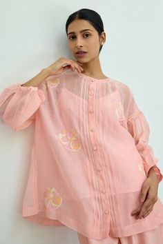 Pink sheer top featuring floral hand embroidery all over with drop shoulders and front button placket. Comes with an inner. - Aza Fashions Spring Sets With Blouson Sleeves, Festive Pink Tops With Chikankari Embroidery, Feminine Spring Tops With Chikankari Embroidery, Feminine Chikankari Embroidered Tops For Spring, Feminine Chikankari Embroidery Tops For Spring, Feminine Chikankari Tops For Spring, Yoke Tops For Spring, Feminine Summer Festive Blouse, Festive Yoke Top