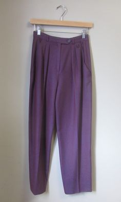 Vintage Emanuel Ungaro trousers. high waist. pleat front. tapered leg. ankle length. slant hip pockets. zip fly closure. crystal embellished logo at front waist. ✩ These pants are an amazing find, rare! Circa 1990s Emanuel Ungaro Made in Italy 100% Wool Eggplant Purple Excellent Condition. No notable flaws. ✂----M e a s u r e m e n t s: all in inches. Waist: 26 Hips: up to 38 Inseam: 26 Rise: 13 Length: 38 All measurements are taken flat. ❉ this is a vintage item and there is ONLY one! Item no. Formal Full-length Purple Bottoms, Purple Formal Full-length Bottoms, Purple Full Length Formal Bottoms, Full Length Purple Formal Bottoms, Formal Purple Bottoms With Pockets, Elegant Purple Bottoms With Pockets, Elegant Full-length Purple Bottoms, Elegant Full Length Purple Bottoms, Purple Workwear Pants With Belt Loops