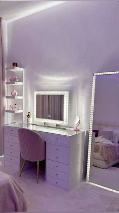 a bedroom with purple walls and white furniture