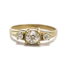 12K Yellow Gold VIntage Three-Diamond Ring. Ladies vintage 12k yellow gold and diamond ring. The gold tests 51% with an XRF metal analyzer. The ring weight is 2.3 grams gross weight. The center diamond is an old-cut, .50 carats, j color, i1 clarity. There is a natural near the edge and a small chip on a crown facet that can only be seen with 10-power magnification. The two side diamonds are round brilliants, i to j color, Vs to Si, .10 total carats. Ring size is 6 3/4 and can be sized, up or dow Three Diamond Ring, Trilogy Engagement Ring, Yellow Gold Diamond Ring, Three Stone Diamond, Vintage Diamond Rings, Ladies Diamond Rings, Yellow Gold Setting, Coin Jewelry, Princess Diamond