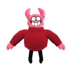 a pink stuffed animal wearing a red sweater