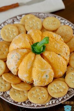 crackers arranged in the shape of a pumpkin on a plate