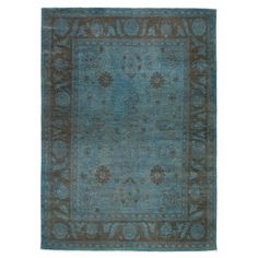 an antique rug with blue and brown colors