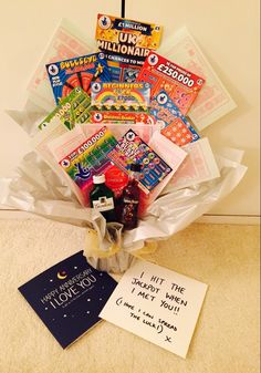 a bouquet of candy and greeting cards on the floor