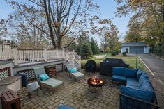 an outdoor patio with seating and fire pit