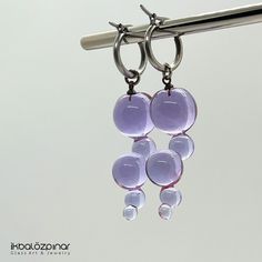 Murano glass handmade earrings. They are unique and they were produced in limited edition only by me. Each piece is handmade in the lampworking techique, which gives it a unique character, therefore each piece can be a little bit different. The hoops are high quality stainless steel. They will never tarnish, it is resistant to bumps and scratches. Diameter of the hoops are 1.5 cm Including the hoop, the earrings are about 5.5 cm long. Modern Round Glass Earrings, Modern Handmade Glass Earrings, Modern Handmade Clear Earrings, Modern Nickel-free Glass Earrings, Modern Glass Earrings, Modern Glass Earrings With Ear Wire, Purple Glass Dangle Earrings, Custom Engraved Necklace, Family Bracelets