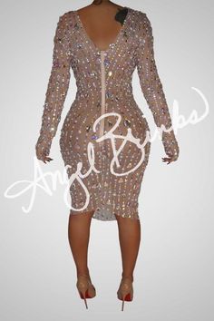 This dress radiates elegance and style with its rhinestone adornment of unique shapes and colors. Constructed from a nude mesh material with moderate stretch, long sleeves and a low-cut zipper up the back, you'll be sure to make an unforgettable impression. As this material is delicate, handle with care when putting on and taking off. Ideal for a night out with friends or a luxurious dinner, you'll be guaranteed to look and feel your best. - All mesh dress embellished with Rhinestone - All stone Luxurious Dinner, Shapes And Colors, Unique Shapes, Handle With Care, Jumpsuit Jacket, Leggings Sale, Maxi Gowns, Bustier Top, Crop Top Blouse