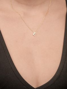 Celebrate your unique identity with the Personalized 14K Gold Tiny Letter Name Necklace, a perfect blend of elegance and simplicity. This custom minimalist letter necklace will provide a beautiful way to showcase your initials or those of a loved one. Crafted from high-quality 14K gold, this necklace will feature a tiny, refined letter pendant, making it a subtle yet meaningful accessory suitable for any occasion. Ideal for women who appreciate personalized jewelry, this necklace will promise to Minimalist Letter Necklaces For Everyday, Minimalist 14k Gold Initial Necklace With Clavicle Chain, Minimalist Initial Name Necklace For Anniversary, Minimalist Initial Necklace With Name For Anniversary, Simple 14k Gold Initial Necklace, Dainty Letter Necklaces For Everyday, Dainty Letter Necklaces For Everyday Wear, Dainty Letter Necklace For Everyday Wear, Minimalist White Initial Necklace For Anniversary