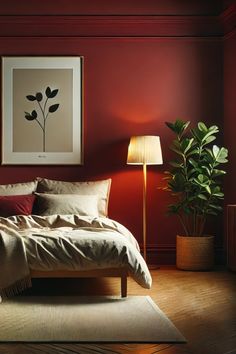 a bed sitting in a bedroom next to a lamp on top of a wooden floor