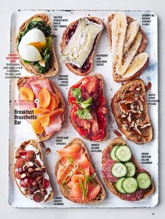 an open book showing different types of sandwiches and cucumber slices on breads