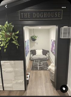 the doghouse is decorated in black, white and grey colors with an indoor plant