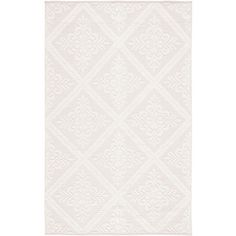 a white rug with an intricate design on it