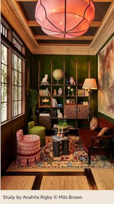 a living room with green walls and furniture