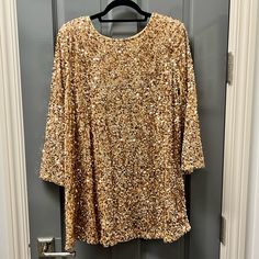 Gold Sequin Long Sleeve Mini Dress With Self-Tie Bow In The Back. Fully Lined. Materials Listed In Pictures Above. Brand New. Gold Long Sleeve Dress For Brunch, Gold Long Sleeve Mini Dress For Brunch, Gold Sequin Mini Dress, Dresses Gold, Dress Gold, Tie Bow, Sequin Mini, Gold Sequin, Sequin Mini Dress