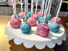 cake pops with pink, blue and white frosting