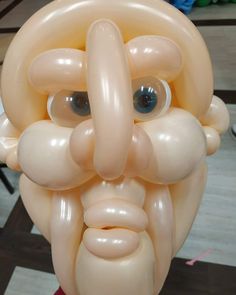 an inflatable balloon with a man's face on it and eyes wide open