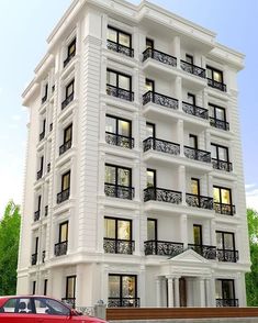 a large white building with balconies and windows