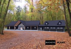 a large house in the woods surrounded by trees