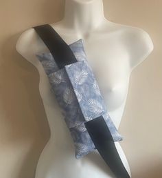 Welcome to my shop.  Posted 1st class within 24 hours (Mon/Fri). Made from high quality Rose & Hubble 100% cotton fabric in Powder Blue. Lovely to the touch, with a smooth finish in the leaves design.  The seatbelt pillow is professionally made and is fully lined in cotton fabric (so not just simply stuffed with filling). The closure flaps wrap tightly around the seatbelt and are also lined in cotton fabric. The flaps are double sewn and also have the benefit of interfacing sewn into them to giv Seatbelt Pillow, Mastectomy Pillow, Top Surgery, Interfacing Sewing, Breast Surgery, Leaves Design, Soft Pillow, Pillow Top, Bright Designs