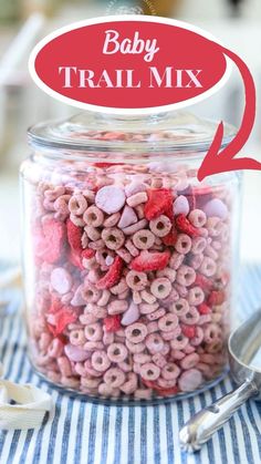 baby trail mix in a glass jar with spoons