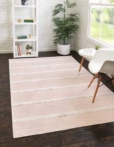 a white and pink rug in a living room