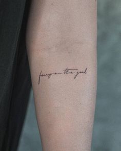 a person with a tattoo on their arm that says, i love you and it is written in cursive writing