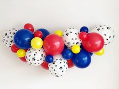 a bunch of balloons that are in the shape of a dog's paw print