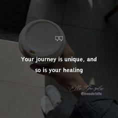 a person holding a coffee cup with the quote your journey is unique, and so is your heating