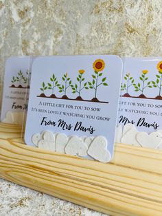 three cards with sunflowers on them sitting next to each other