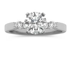 a three stone engagement ring with diamonds