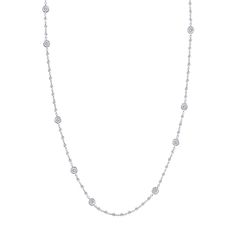 The love is in the details with this diamond by the yard necklace. Featuring an intricately detailed chain made of micro bezel diamonds that shines separating staggering larger bezel set diamonds, this 18k white gold necklace dances on your skin. So much glimmer packed into one dazzling diamond necklace that is ideal for everyday outfits! 18k White Gold 70 Round Diamonds 2.24ctw Diamonds Bezel Set Diamonds 16" Length Lobster Clasp Diamond Bezel Setting White Gold Station Necklace, White Gold Diamond Station Necklace With Bezel Setting, Dainty White Gold Diamond Necklace With Sparkling Stones, Dazzling Diamond-white Diamond Necklace With Bezel Setting, Silver Diamond Station Necklace, Platinum Bezel Set Diamond Necklace, Platinum Diamond Necklace With Bezel Setting, Silver Station Necklace In Fine Jewelry Style, Delicate Diamond White Necklace With Bezel Setting