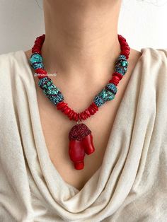 ✨Make a bold statement with our **Gold-Plated Boho Chic Necklace featuring large **Red Coral** and **Turquoise Beads**. This handcrafted piece is designed for those who love a blend of natural elements and elegant sparkle. ✨ **Eye-Catching Materials The necklace showcases large turquoise stones adorned with rhinestones, paired with vibrant red coral beads. The gold plating enhances the bohemian elegance, making this a standout accessory. 💎 **Stunning Red Coral Pendant The focal point of the nec Red Bohemian Beaded Necklaces With Stones, Bohemian Red Beaded Necklaces With Stones, Red Natural Stones Beaded Necklace, Vibrant Red Beaded Necklace For Gift, Bold Red Handmade Necklace, Unique Red Stone Necklaces, Vibrant Red Handmade Beaded Necklace, Handmade Vibrant Red Beaded Necklaces, Handmade Vibrant Red Beaded Necklace