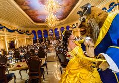 the beauty and the beast are dressed up in fancy costumes for a formal function at disney's grand florie