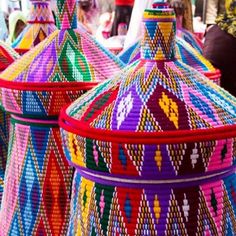 colorful baskets are stacked on top of each other