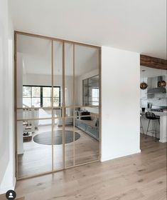 an open kitchen and living room with sliding glass doors