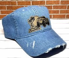 Bronco Hat - Denim Distressed Ponytail Bronco Custom Leatherette Patch Hat  Custom made leatherette patch attached to ponytail hat.  One size fit all.  Each hat looks slightly different in distressed look. Each patch is custom engraved so may look slightly different from the picture.   We do not recommend machine wash.  Hand wash only.   Please check out our store for hat designs that might catch your eye. Shipping:  All of our shipping comes with a tracking number to monitor your purchase. We a Distressed Medium Wash Adjustable Hat, Bronco Custom, Patch Hat, Ponytail Hat, Hat Custom, Pompano Beach, Business Thank You, Hat Designs, Trucker Cap