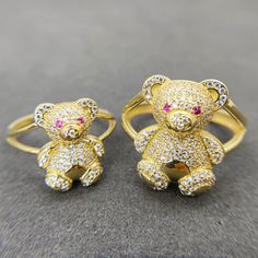 10k Solid Gold Teddy Bear Colorful CZ Ring * Metal : Real 10K Yellow Gold * Condition : Brand New * Finish : Polished * Size : 5 ~ 12 * Weight : 3.3 ~ 6.3 gram This is an approximate size & weight. Please expect up to ±10% difference. * Processing time : 1~3 business days * Ships from California This is 100% Authentic 10k Gold. Not plated or filled. All of our items are brand new and are shipped with a gift box. Yellow Gold Cubic Zirconia Couple Rings As Gift, Gold Cubic Zirconia Crystal Ring For Valentine's Day, Yellow Gold Rings For Birthday Or Valentine's Day, Yellow Gold Cubic Zirconia Crystal Ring Gift, Gold Couple Rings With Prong Setting For Gift, Gold Couple Rings With Prong Setting As Gift, Gold Couple Rings With Prong Setting, Bling Round Rings For Gifts, Bling Crystal Ring As Gift