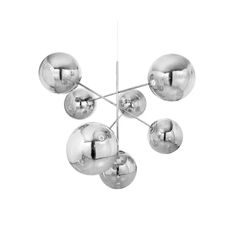 a chrome chandelier with five balls hanging from the ceiling