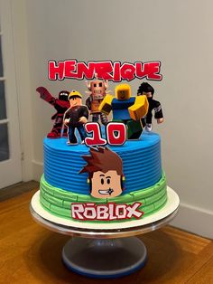 a birthday cake decorated with the characters of roblox and his friends on it