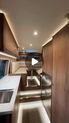 the inside of a motor home with wood paneling