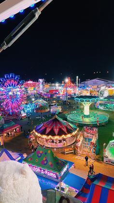 an aerial view of a carnival at night